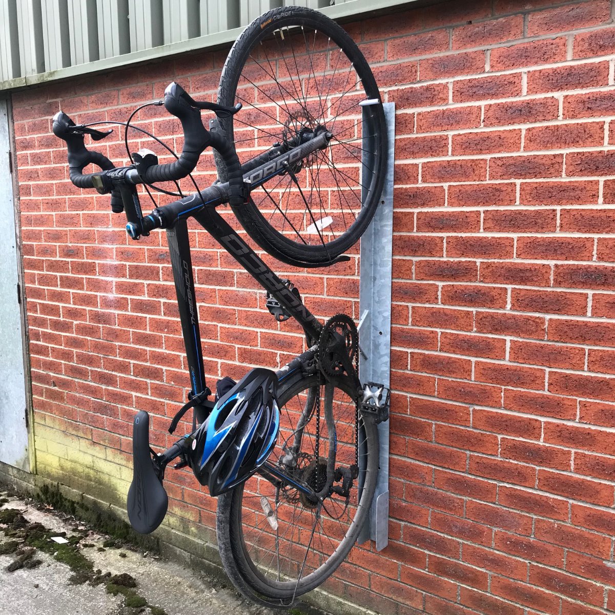 Eltham vertical cycle trough connected to a wall and bike.