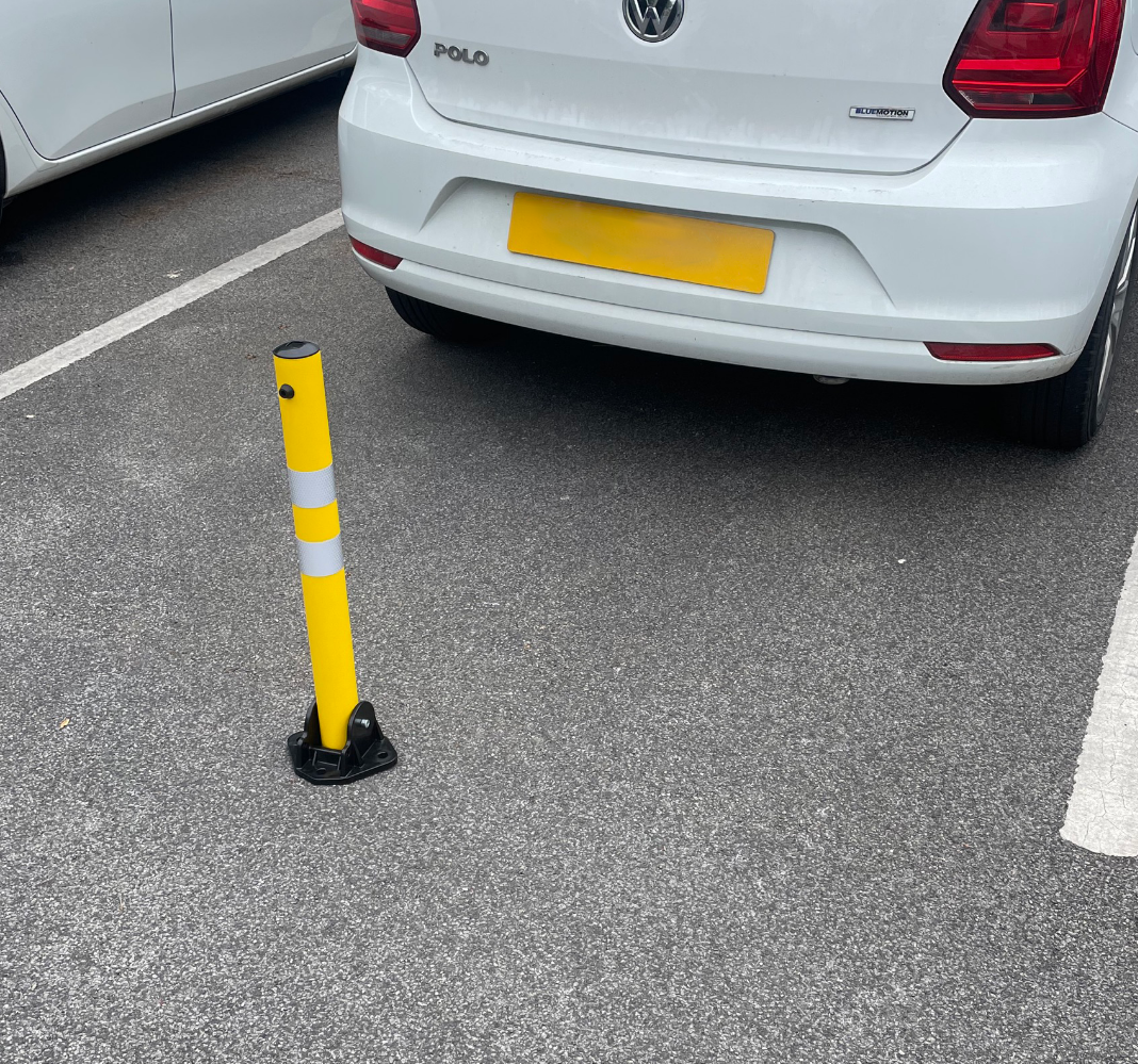 Lifestyle image of the parking bollard behind the car.