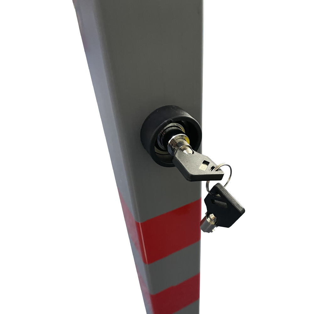 Close up of the key in the lock for the grey plastic bollard.