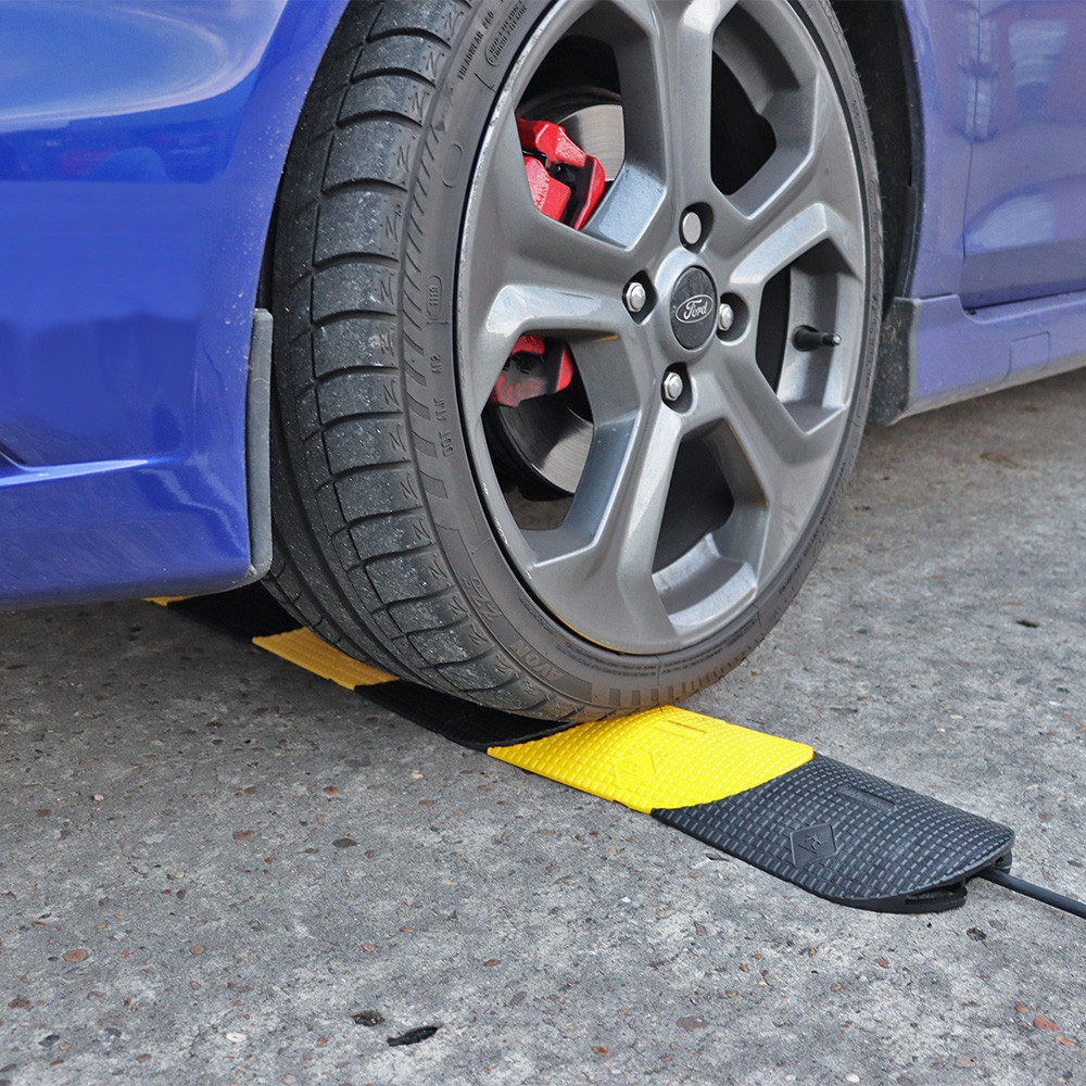 CableGuardX Flexible Cable Protector Under Vehicle Wheel